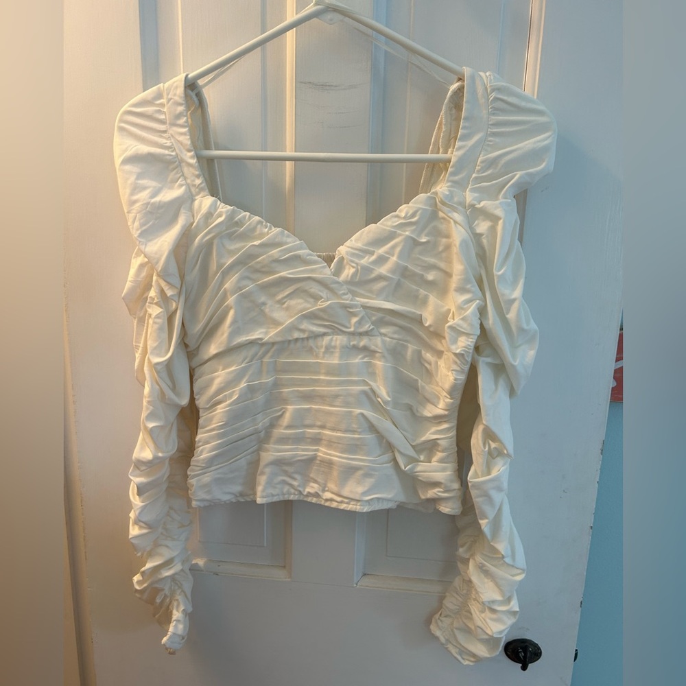 White long sleeve ruffle top